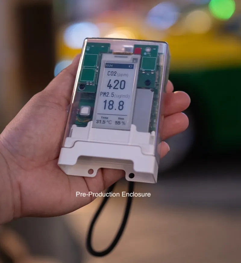 AirGradient Go held in one hand